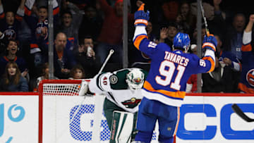 NEW YORK, NY - FEBRUARY 19: John Tavares #91 of the New York Islanders celebrates a second-period goal by teammate Anders Lee #27 (not pictured) against Devan Dubnyk #40 of the Minnesota Wild at Barclays Center on February 19, 2018 in the Brooklyn borough of New York City. (Photo by Paul Bereswill/NHLI via Getty Images)