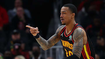 ATLANTA, GEORGIA - JANUARY 21: John Collins #20 of the Atlanta Hawks reacts after hitting a three-point basket against the Miami Heat during the first half at State Farm Arena on January 21, 2022 in Atlanta, Georgia. NOTE TO USER: User expressly acknowledges and agrees that, by downloading and or using this photograph, User is consenting to the terms and conditions of the Getty Images License Agreement. (Photo by Kevin C. Cox/Getty Images)