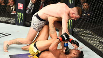 DETROIT, MI - DECEMBER 02: (L-R) Paul Felder punches Charles Oliveira of Brazil in their lightweight bout during the UFC 218 event inside Little Caesars Arena on December 02, 2017 in Detroit, Michigan. (Photo by Josh Hedges/Zuffa LLC/Zuffa LLC via Getty Images)