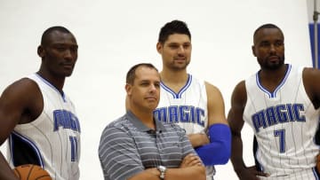 Sep 26, 2016; Orlando, FL, USA; Orlando Magic head coach Frank Vogel, center Bismack Biyombo (11), center Nikola Vucevic (9) and forward Serge Ibaka (7) pose for a photo during media day at Amway Center. Mandatory Credit: Kim Klement-USA TODAY Sports