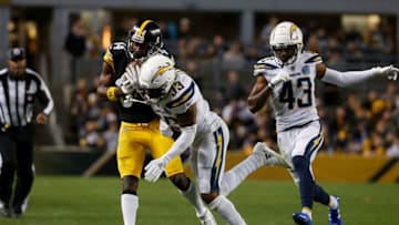 PITTSBURGH, PA - DECEMBER 02: Antonio Brown #84 of the Pittsburgh Steelers is hit after a catch by Derwin James #33 of the Los Angeles Chargers in the first half during the game at Heinz Field on December 2, 2018 in Pittsburgh, Pennsylvania. (Photo by Justin K. Aller/Getty Images)