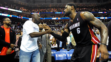 Michael Jordan shakes hands with Miami Heat forward LeBron James, after the Heat defeated the Bobcats, 109-98, in Game 4 of the NBA Eastern Conference quarterfinals at Time Warner Cable Arena in Charlotte, N.C., Monday, April 28, 2014. (David T. Foster III/Charlotte Observer/TNS via Getty Images)