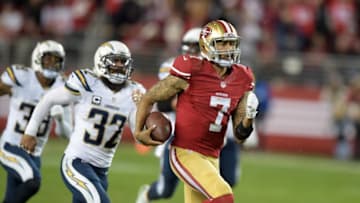 Dec 20, 2014; Santa Clara, CA, USA; San Francisco 49ers quarterback Colin Kaepernick (7) is pursued by San Diego Chargers safety Eric Weddle (32) on a 94-yard touchdown run in the third quarter at Levi