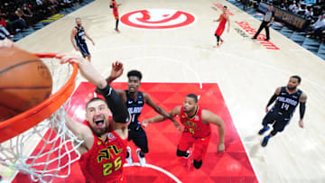 ATLANTA, GA - FEBRUARY 10: Alex Len #25 of the Atlanta Hawks dunks against the Orlando Magic on February 10, 2019 at State Farm Arena in Atlanta, Georgia. NOTE TO USER: User expressly acknowledges and agrees that, by downloading and/or using this Photograph, user is consenting to the terms and conditions of the Getty Images License Agreement. Mandatory Copyright Notice: Copyright 2019 NBAE (Photo by Scott Cunningham/NBAE via Getty Images)