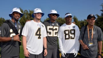Jan 28, 2016; Kahuku, HI, USA; Oakland Raiders players Charles Woodson (24), Derek Carr (4), Khalil Mack (52), Amari Cooper (89) and former player Willie Brown pose during Team Rice practice for the 2016 Pro Bowl at the Turtle Bay Resort. Mandatory Credit: Kirby Lee-USA TODAY Sports