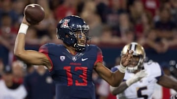 Sep 24, 2016; Tucson, AZ, USA; Arizona Wildcats quarterback Brandon Dawkins (13) passes the ball during the third quarter against the Washington Huskies at Arizona Stadium. Washington won 35-28 in overtime. Mandatory Credit: Casey Sapio-USA TODAY Sports