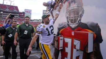 Dec 21, 2014; Tampa, FL, USA; Green Bay Packers quarterback Aaron Rodgers (12) high-fives fans as the Packers beat the Tampa Bay Buccaneers 20-13 at Raymond James Stadium. Mandatory Credit: David Manning-USA TODAY Sports