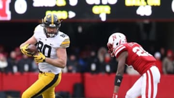 Nov 27, 2015; Lincoln, NE, USA; Nebraska Cornhuskers linebacker Thomas Connely (26) tackles Iowa Hawkeyes tight end Henry Krieger Coble (80) in the second quarter at Memorial Stadium. Mandatory Credit: Reese Strickland-USA TODAY Sports