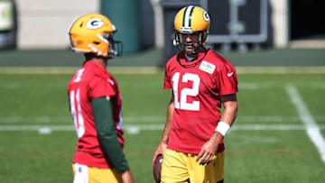 ASHWAUBENON, WISCONSIN - AUGUST 17: Aaron Rodgers #12 of the Green Bay Packers and Jordan Love #10 participate in work outs during training camp at Ray Nitschke Field on August 17, 2020 in Ashwaubenon, Wisconsin. (Photo by Stacy Revere/Getty Images)