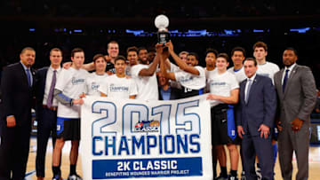 NEW YORK, NY - NOVEMBER 22: Members of the Duke Blue Devils celebrate with the trophy after defeating the Georgetown Hoyas after the 2K Classic championship game at Madison Square Garden on November 22, 2015 in New York City. (Photo by Jim McIsaac/Getty Images)