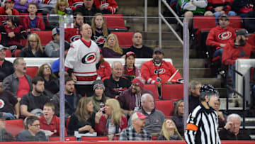 RALEIGH, NC - JANUARY 21: NHL referee Wes McCauley (4) gets berated by a fan during a game between the Vegas Golden Knights and the Carolina Hurricanes at the PNC Arena in Raleigh, NC on January 21, 2018. Vegas defeated Carolina 5-1. (Photo by Greg Thompson/Icon Sportswire via Getty Images)