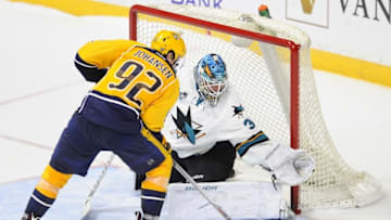 Apr 2, 2016; Nashville, TN, USA; San Jose Sharks goalie James Reimer (34) makes a save on a shootout attempt by Nashville Predators center Ryan Johansen (92) at Bridgestone Arena. The Sharks won 3-2 in a shootout. Mandatory Credit: Christopher Hanewinckel-USA TODAY Sports