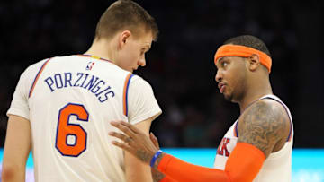Dec 9, 2016; Sacramento, CA, USA; New York Knicks forward Carmelo Anthony (7) talks with forward Kristaps Porzingis (6) during the second half at Golden 1 Center. The Knicks defeated the Kings 103-100. Mandatory Credit: Sergio Estrada-USA TODAY Sports