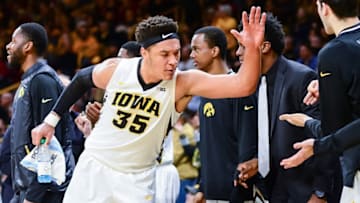 Dec 8, 2016; Iowa City, IA, USA; Iowa Hawkeyes forward Cordell Pemsl (35) celebrates with the Hawkeyes bench during the second half against the Iowa State Cyclones at Carver-Hawkeye Arena. Iowa won 78-64. Mandatory Credit: Jeffrey Becker-USA TODAY Sports
