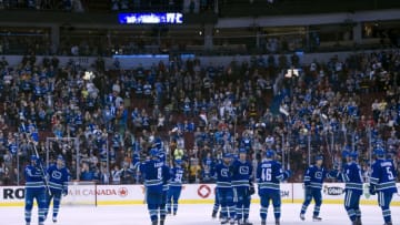 VANCOUVER, BC - APRIL 13: The Vancouver Canucks salute their fans after playing their last game of the NHL season against the Calgary Flames on April 13, 2014 at Rogers Arena in Vancouver, British Columbia, Canada. (Photo by Rich Lam/Getty Images)