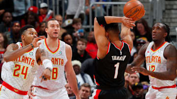 Evan Turner, Kent Bazemore (Photo by Kevin C. Cox/Getty Images)