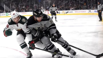 Jan 7, 2017; Los Angeles, CA, USA; Los Angeles Kings left wing Dwight King (74) and Minnesota Wild defenseman Matt Dumba (24) battle for the puck in the second period of the game at Staples Center. Mandatory Credit: Jayne Kamin-Oncea-USA TODAY Sports