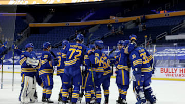 Apr 3, 2021; Buffalo, New York, USA; The Buffalo Sabres celebrate after defeating the New York Rangers at KeyBank Center. Mandatory Credit: Timothy T. Ludwig-USA TODAY Sports