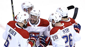 TORONTO, ONTARIO - AUGUST 12: Shea Weber #6 of the Montreal Canadiens is congratulated by teammates Jonathan Drouin #92, Jeff Petry #26,Nick Suzuki #14 and Brendan Gallagher #11 of the Montreal Canadiens after Weber scored a power play goal in the second period against the Philadelphia Flyers n Game One of the Eastern Conference First Round during the 2020 NHL Stanley Cup Playoffs at Scotiabank Arena on August 12, 2020 in Toronto, Ontario. (Photo by Elsa/Getty Images)