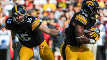 Sep 3, 2016; Iowa City, IA, USA; Iowa Hawkeyes quarterback C.J. Beathard (16) hands the ball off to running back LeShun Daniels Jr. (29) during the third quarter at Kinnick Stadium. The Hawkeyes won 45-21. Mandatory Credit: Jeffrey Becker-USA TODAY Sports