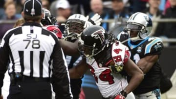 Nov 16, 2014; Charlotte, NC, USA; Atlanta Falcons center James Stone (62) and wide receiver Roddy White (84) and Carolina Panthers defensive end Kony Ealy (94) and strong safety Roman Harper (41) scuffle on the field in the third quarter. The Falcons defeated the Panthers 19-17 at Bank of America Stadium. Mandatory Credit: Bob Donnan-USA TODAY Sports