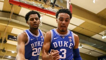 LAHAINA, HI - NOVEMBER 21: Marques Bolden #20 and Tre Jones #3 of the Duke Blue Devils help up teammate RJ Barrett #5 from the floor during the first half of the game against the Gonzaga Bulldogs at the Lahaina Civic Center on November 21, 2018 in Lahaina, Hawaii. (Photo by Darryl Oumi/Getty Images)