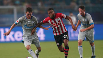 KUNSHAN, CHINA - JULY 05: Benjamin Goller of Schalke FC competes the ball with Byan Bertrand of Southampton FC during the 2018 Clubs Super Cup match between Schalke and Southampton at Kunshan Sports Center Stadium on July 5, 2018 in Kunshan, Jiangsu Provinceon, China. (Photo by Lintao Zhang/Getty Images)