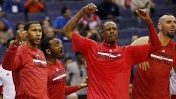 Oct 12, 2014; Washington, DC, USA; Washington Wizards guard Garrett Temple (L), Wizards guard John Wall (M-L), Wizards forward Paul Pierce (M), and Wizards center Marcin Gortat (M-R) celebrate on the bench against the Detroit Pistons at Verizon Center. Mandatory Credit: Geoff Burke-USA TODAY Sports