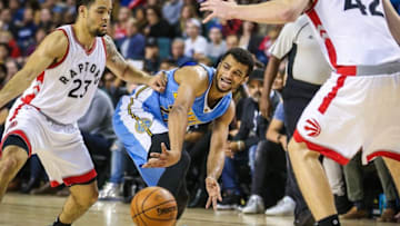 Oct 3, 2016; Calgary, Alberta, CAN; Denver Nuggets guard Jamal Murray (27) passes the ball under pressure from Toronto Raptors guard Fred VanVleet (23) during the fourth quarter at Scotiabank Saddledome. Denver won 108-106. Mandatory Credit: Sergei Belski-USA TODAY Sports