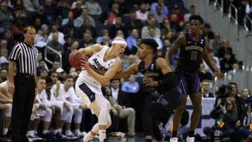 COLUMBUS, OHIO - MARCH 22: Brock Miller #22 of the Utah State Aggies is pressed by Jamal Bey #0 of the Washington Huskies during the second half of the game in the first round of the 2019 NCAA Men's Basketball Tournament at Nationwide Arena on March 22, 2019 in Columbus, Ohio. (Photo by Gregory Shamus/Getty Images)