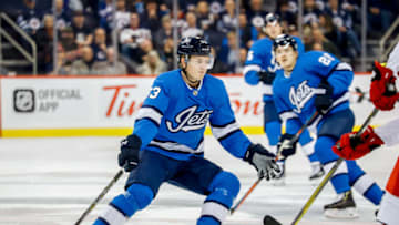 WINNIPEG, MB - OCTOBER 14: Kristian Vesalainen #93 of the Winnipeg Jets keeps an eye on the play during second period action against the Carolina Hurricanes at the Bell MTS Place on October 14, 2018 in Winnipeg, Manitoba, Canada. The Jets defeated the Canes 3-1. (Photo by Darcy Finley/NHLI via Getty Images)