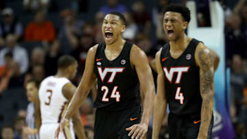 CHARLOTTE, NORTH CAROLINA - MARCH 14: Teammates Kerry Blackshear Jr. #24 and Nickeil Alexander-Walker #4 of the Virginia Tech Hokies react against the Florida State Seminoles during their game in the quarterfinal round of the 2019 Men's ACC Basketball Tournament at Spectrum Center on March 14, 2019 in Charlotte, North Carolina. (Photo by Streeter Lecka/Getty Images)