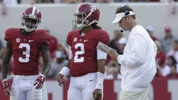 Sep 10, 2016; Tuscaloosa, AL, USA; Alabama Crimson Tide offensive coordinator Lane Kiffin talks with quarterback Jalen Hurts (2) and wide receiver Calvin Ridley (3) during the game against Western Kentucky Hilltoppers at Bryant-Denny Stadium. The Tide defeated the Hilltoppers 38-10. Mandatory Credit: Marvin Gentry-USA TODAY Sports