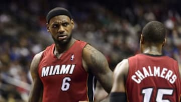 Oct 30, 2013; Philadelphia, PA, USA; Miami Heat forward LeBron James (6) and guard Mario Chalmers (15) during the fourth quarter against the Philadelphia 76ers at Wells Fargo Center. The Sixers defeated the Heat 114-110. Mandatory Credit: Howard Smith-USA TODAY Sports