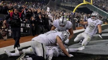 OAKLAND, CALIFORNIA - NOVEMBER 07: Josh Jacobs #28 of the Oakland Raiders celebrates with teammates after scoring on an 18-yard touchdown run late in the fourth quarter against the Los Angeles Chargers at RingCentral Coliseum on November 07, 2019 in Oakland, California. The Raiders won 26-24. (Photo by Thearon W. Henderson/Getty Images)