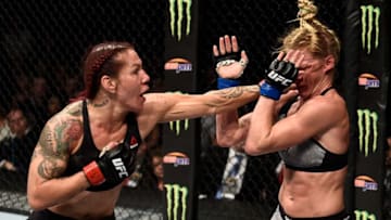 LAS VEGAS, NV - DECEMBER 30: (L-R) Cris Cyborg of Brazil punches Holly Holm in their women's featherweight bout during the UFC 219 event inside T-Mobile Arena on December 30, 2017 in Las Vegas, Nevada. (Photo by Jeff Bottari/Zuffa LLC/Zuffa LLC via Getty Images)