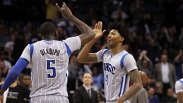 Jan 14, 2015; Orlando, FL, USA; Orlando Magic guard Victor Oladipo (5) and guard Elfrid Payton (4) high five after Oladipo dunked against the Houston Rockets during the second half at Amway Center. Orlando Magic defeated the Houston Rockets 120-113. Mandatory Credit: Kim Klement-USA TODAY Sports