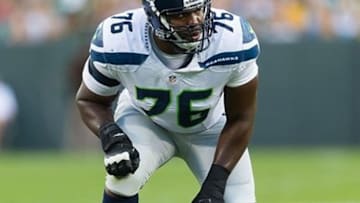 Aug 23, 2013; Green Bay, WI, USA; Seattle Seahawks offensive tackle Russell Okung (76) during the game against the Green Bay Packers at Lambeau Field. Seattle won 17-10. Mandatory Credit: Jeff Hanisch-USA TODAY Sports