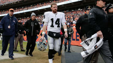 Jan 1, 2017; Denver, CO, USA; Oakland Raiders quarterback Matt McGloin (14) leaves the field in the second quarter against the Denver Broncos at Sports Authority Field at Mile High. Mandatory Credit: Isaiah J. Downing-USA TODAY Sports