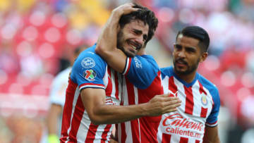 Antonio Briseño is hugged by a Chivas teammate after he scored the first goal of the game against the Tigres. (Photo by Refugio Ruiz/Getty Images)