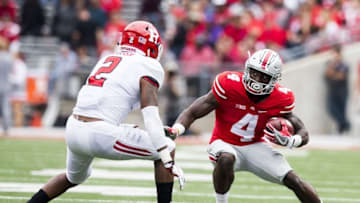 Oct 1, 2016; Columbus, OH, USA; Ohio State Buckeyes running back Curtis Samuel (4) fakes his way around Rutgers Scarlet Knights defensive back Kiy Hester (2) at Ohio Stadium. Ohio State won the game 58-0. Mandatory Credit: Greg Bartram-USA TODAY Sports