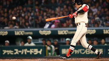 NISHINOMIYA, JAPAN - NOVEMBER 11: Yamato Maeda #0 of Hanshin Tigers and Yomiuri Giants bats during the friendly match between Hanshin Tigers and Yomiuri Giants at the Hanshin Koshien Stadium on November 11, 2014 in Nishinomiya, Japan. (Photo by Atsushi Tomura/Getty Images)
