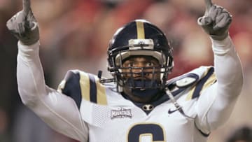 SALT LAKE CITY, UT - NOVEMBER 20: Curtis Brown #6 of BYU celebrates a touchdown against the University of Utah during the second quarter November 20, 2004 at Rice Eccles Stadium in Salt Lake City, Utah. (Photo by George Frey/Getty Images)