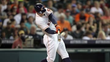 Jun 30, 2014; Houston, TX, USA; Houston Astros right fielder George Springer (4) hits a home run during the first inning against the Seattle Mariners at Minute Maid Park. Mandatory Credit: Troy Taormina-USA TODAY Sports