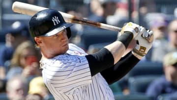 NEW YORK, NY - MAY 18: Clint Frazier #77 of the New York Yankees follows through on his grounder hit in an MLB baseball game against the Tampa Bay Rays on May 18, 2019 at Yankee Stadium in the Bronx borough of New York City. Yankees lost 2-1. Teams wore camouflage caps and accessories to honor the military today for Armed Forces Day. (Photo by Paul Bereswill/Getty Images)