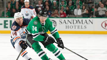 DALLAS, TX - DECEMBER 3: Roope Hintz #24 of the Dallas Stars tries to keep the puck away against Zack Kassian #44 of the Edmonton Oilers at the American Airlines Center on December 3, 2018 in Dallas, Texas. (Photo by Glenn James/NHLI via Getty Images)