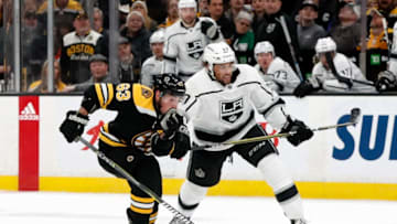 BOSTON, MA - FEBRUARY 09: Los Angeles Kings left wing Alex Iafallo (19) interest with Boston Bruins left wing Brad Marchand (63) during a game between the Boston Bruins and the Los Angeles Kings on February 9, 2019, at TD Garden in Boston, Massachusetts. (Photo by Fred Kfoury III/Icon Sportswire via Getty Images)