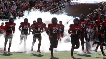 Nov 15, 2014; Lubbock, TX, USA; The Texas Tech Red Raiders enter the field before the game with the Oklahoma Sooners at Jones AT&T Stadium. Mandatory Credit: Michael C. Johnson-USA TODAY Sports
