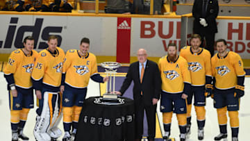 Apr 7, 2018; Nashville, TN, USA; (From left to right) Nashville Predators center Ryan Johansen (92) goalie Pekka Rinne (35) defenseman Roman Josi (59) defenseman Ryan Ellis (4) defenseman Mattias Ekholm (14) and left wing Filip Forsberg (9) pose with NHL deputy commissioner Bill Daly as the Nashville Predators are awarded the Presidents' Trophy before the game against the Columbus Blue Jackets at Bridgestone Arena. Mandatory Credit: Christopher Hanewinckel-USA TODAY Sports