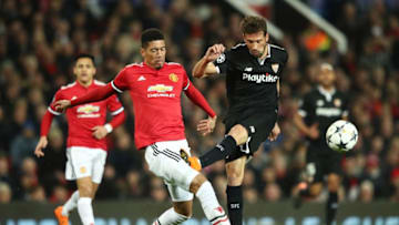 MANCHESTER, ENGLAND - MARCH 13: Franco Vazquez of Sevilla is blocked by Chris Smalling of Manchester United during the UEFA Champions League Round of 16 Second Leg match between Manchester United and Sevilla FC at Old Trafford on March 13, 2018 in Manchester, United Kingdom. (Photo by Clive Mason/Getty Images)